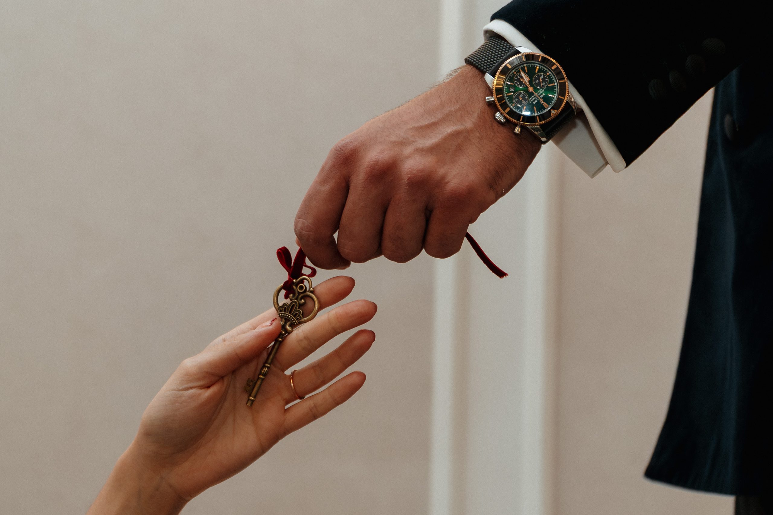 Luxury watch and key exchange at Modernist private members club London lifestyle moment