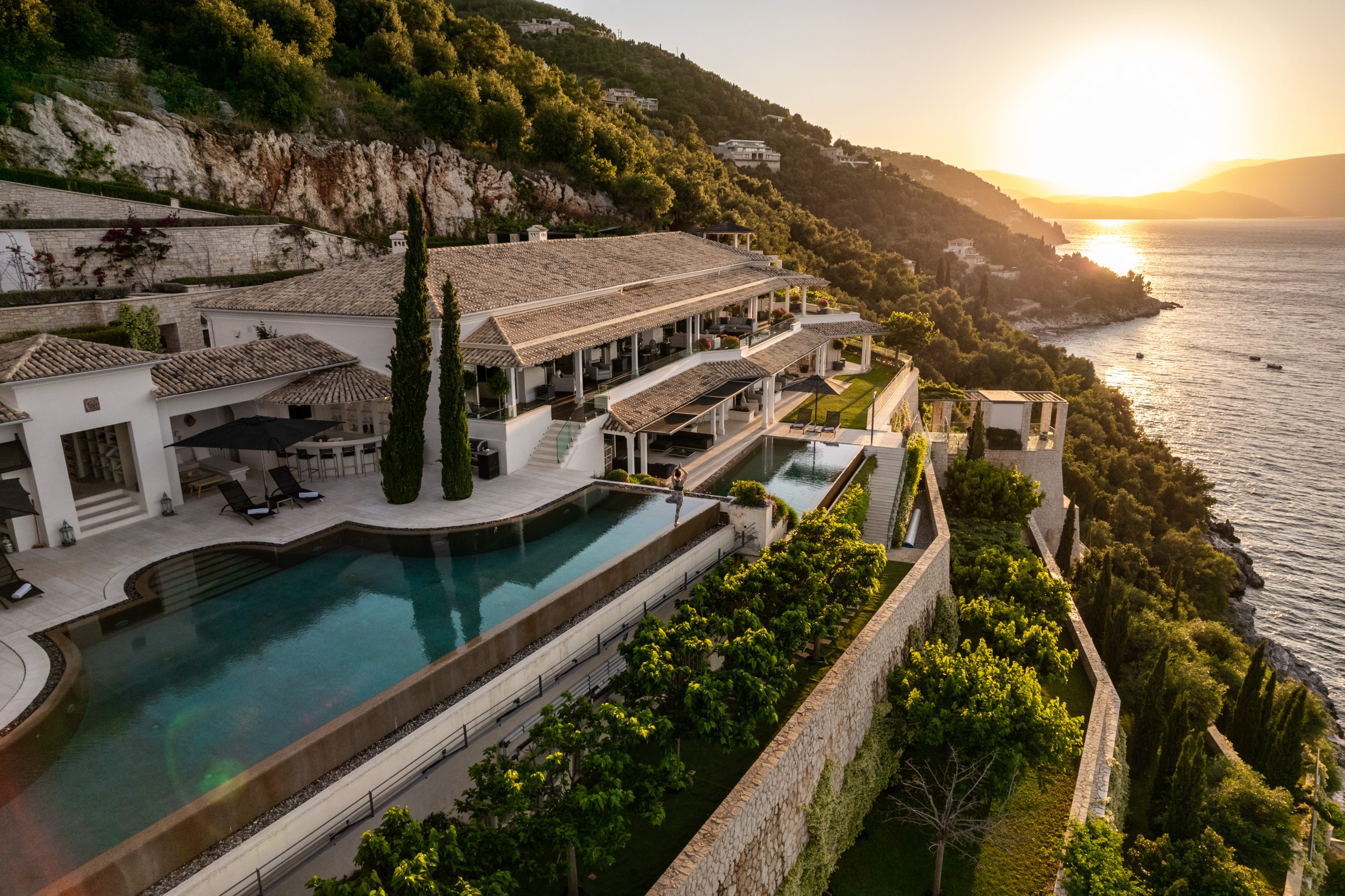 OB Private OB Travel luxury villa Corfu Greece aerial photography by 36 Studios — clifftop estate with infinity pool and Ionian Sea sunset